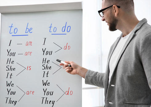 Tutor explaining grammar and sentence structure