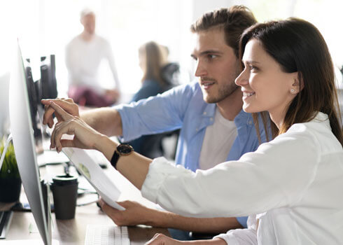 Two reviewers assessing a manuscript on screen